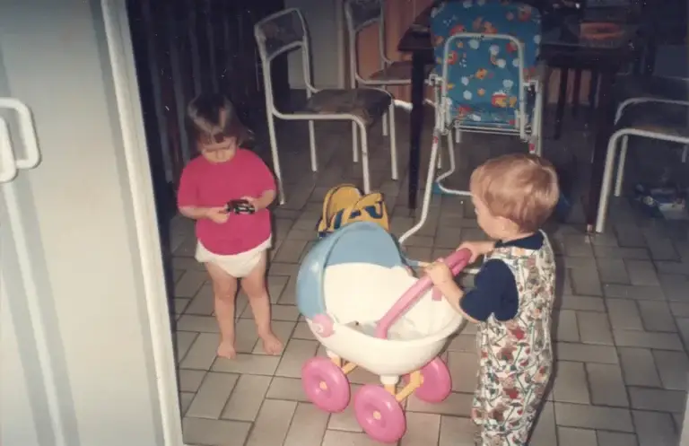 two toddlers playing with each other