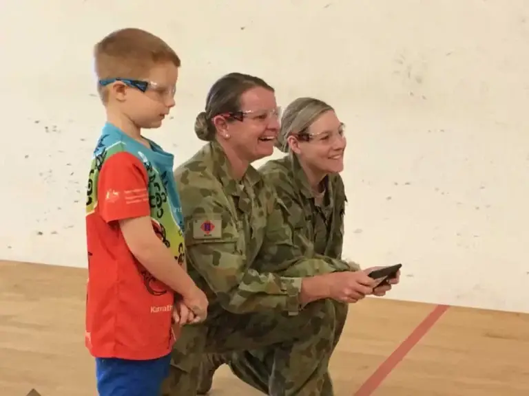 She Maps Chief Testing Officer Hamish flies a drone with two female soldiers