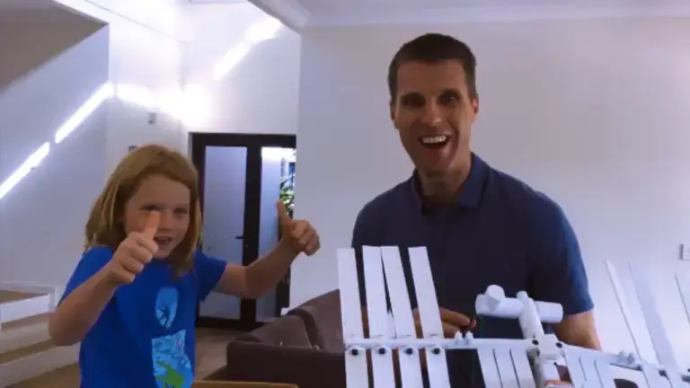 Paul Mead teaching a kid how to send supplies to the Space Station using a drone