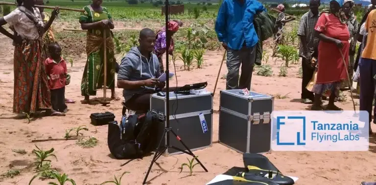 The Tanzania Flying Labs setting up their drone equipment in a rural area
