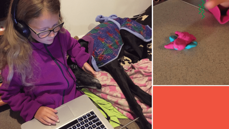 a young girl sitting beside her dog while taking online classes from home