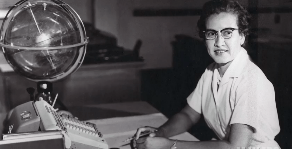 Geography STEM NASA scientist, Katherine Johnson, sits at her desk with a Celestial Training Device