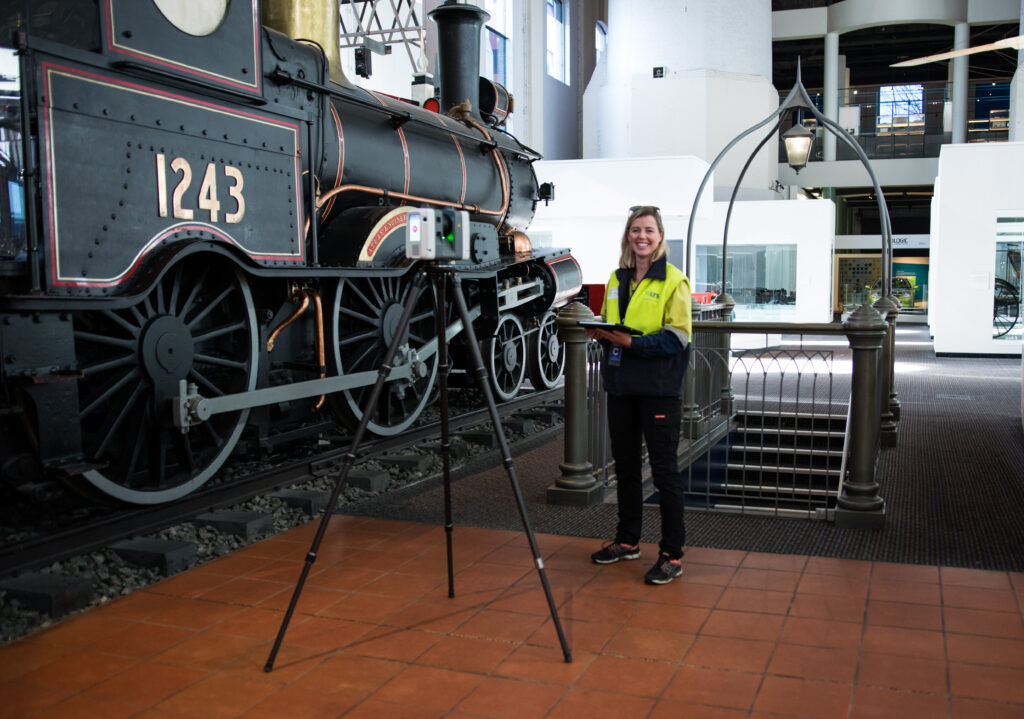 a female registered surveyor working in front of Loco #124