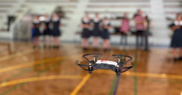 an educational drone in mid-air indoors