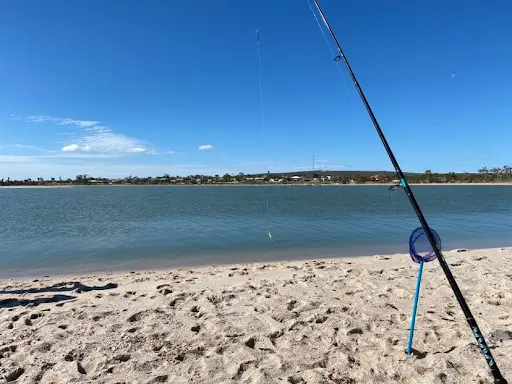 beach walk with a fishing rod