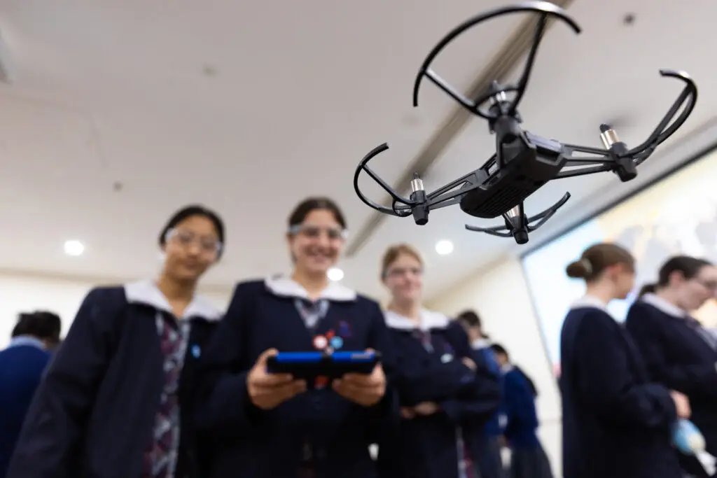She Maps students learning to fly drones