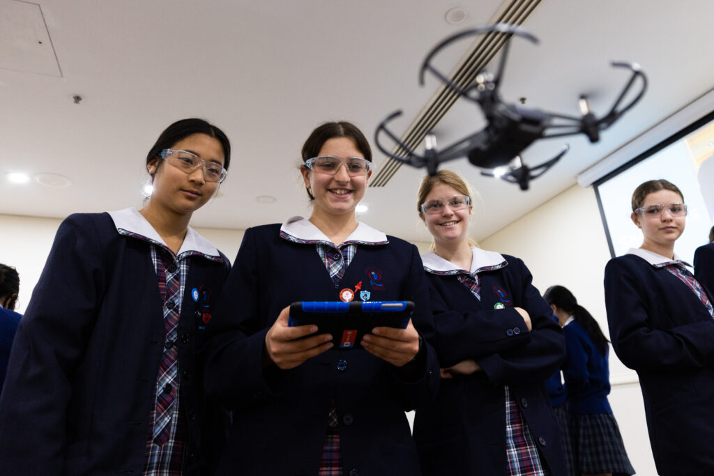 Students learning to fly drones