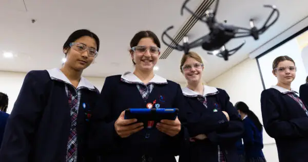 Students learning to fly drones