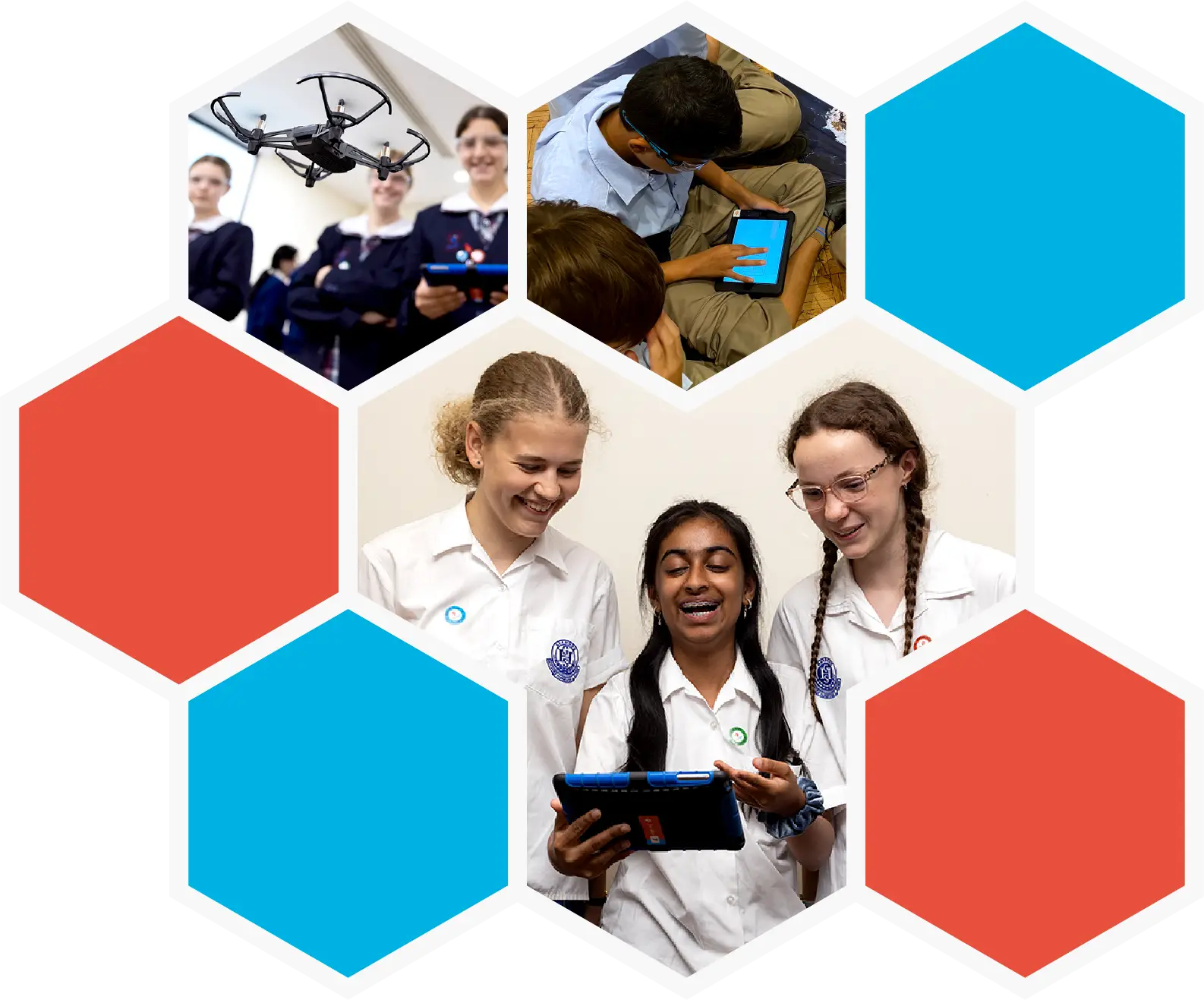 female school students flying indoor drone