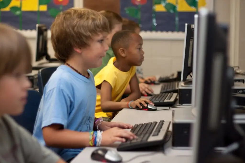 young students navigating desktop