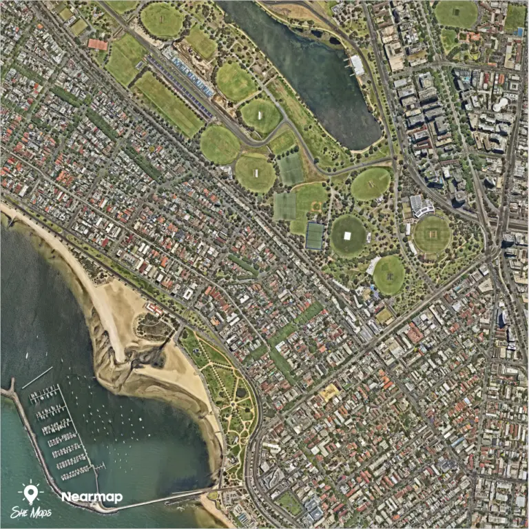 Aerial view of coastal suburb with parks