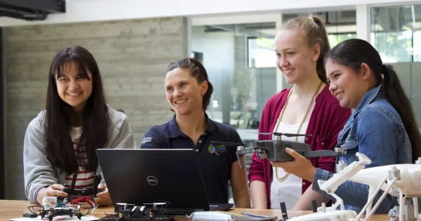 Dr Karen Joyce and students displaying drones
