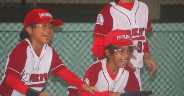 Indonesia's girls baseball team having fun while flying a drone