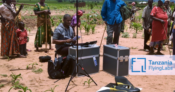 The Tanzania Flying Labs setting up their drone equipment in a rural area