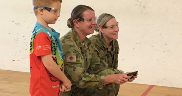 She Maps Chief Testing Officer Hamish flies a drone with two female soldiers