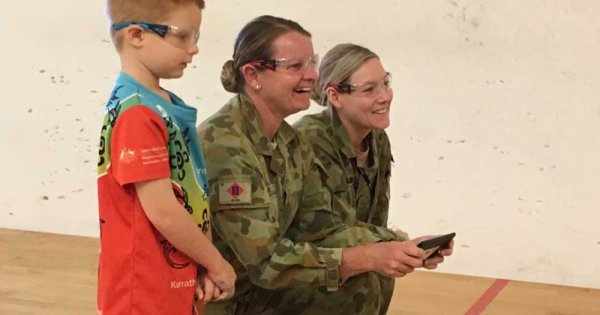 She Maps Chief Testing Officer Hamish flies a drone with two female soldiers
