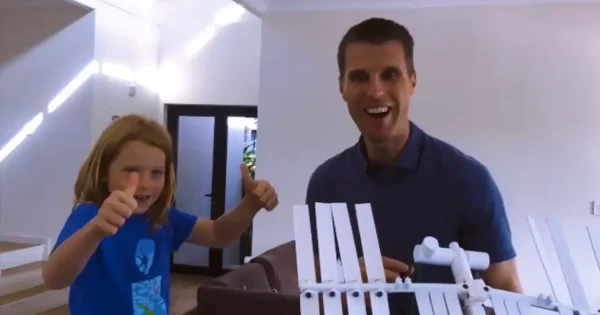 Paul Mead teaching a kid how to send supplies to the Space Station using a drone