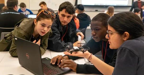 young men and women taking advanced drone programs for schools